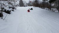 Jackie racing a local for pink slips (Category:  Ice Climbing, Skiing)