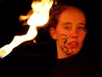 Jess fire juggling before the Saturday show. (Category:  Photography)