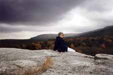 Sarah sitting on top of Peter's Kill at the end of the trip.  Watching a storm roll in. (Category:  Photography)