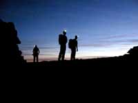 Josh, Keith and Guy reaching the base of Castleton just as the sun starts to lighten the sky. (Category:  Photography)