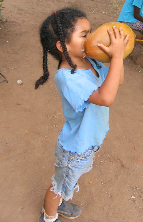 Sophia drinking Madafu. (Category:  Travel)