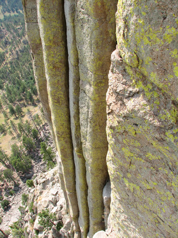 The vertical chimneys of Devil's Tower.  The tower is the hardened cone of an old volcano which has since eroded away. (Category:  Rock Climbing)
