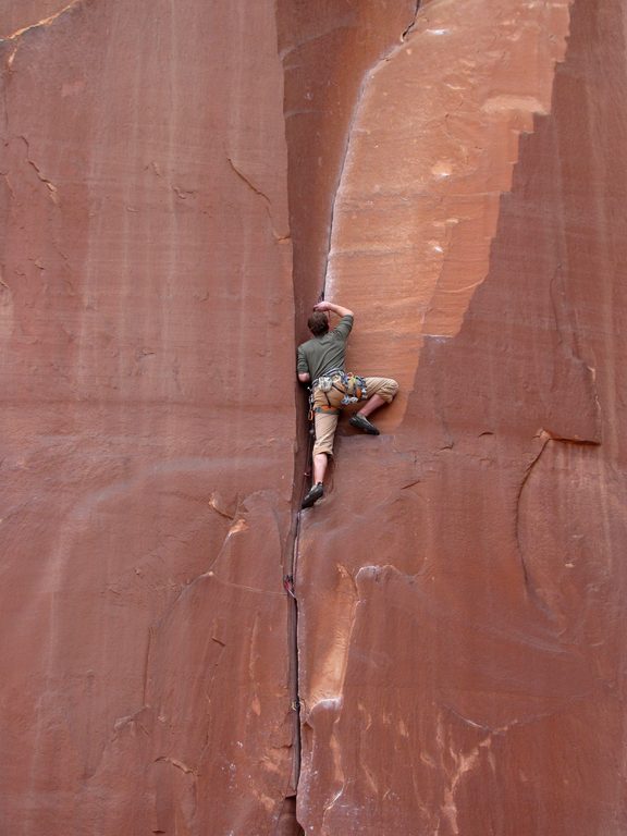 Guy leading some 5.9 climb. (Category:  Rock Climbing)