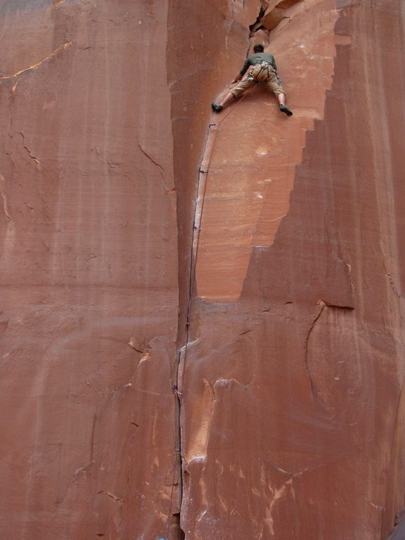 Guy leading some 5.9 climb. (Category:  Rock Climbing)