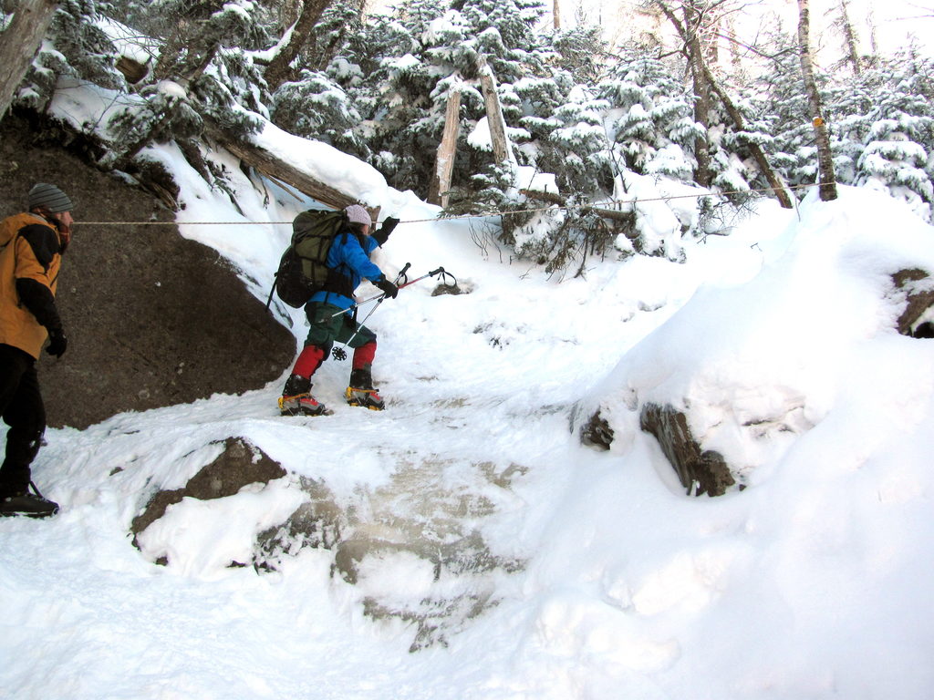 Cathy using a hand line to cross the ice step. (Category:  Ice Climbing)